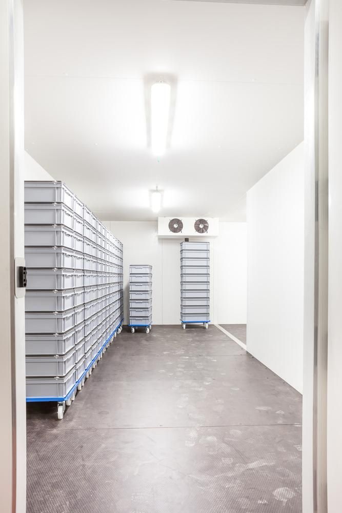 A Room With a Lot of Shelves and Boxes in It — Atmosphere Air Conditioning & Refrigeration In Taylors Beach, NSW