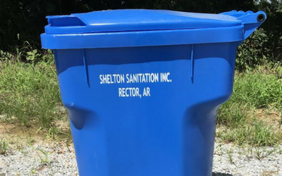 Blue trash bin labeled 
