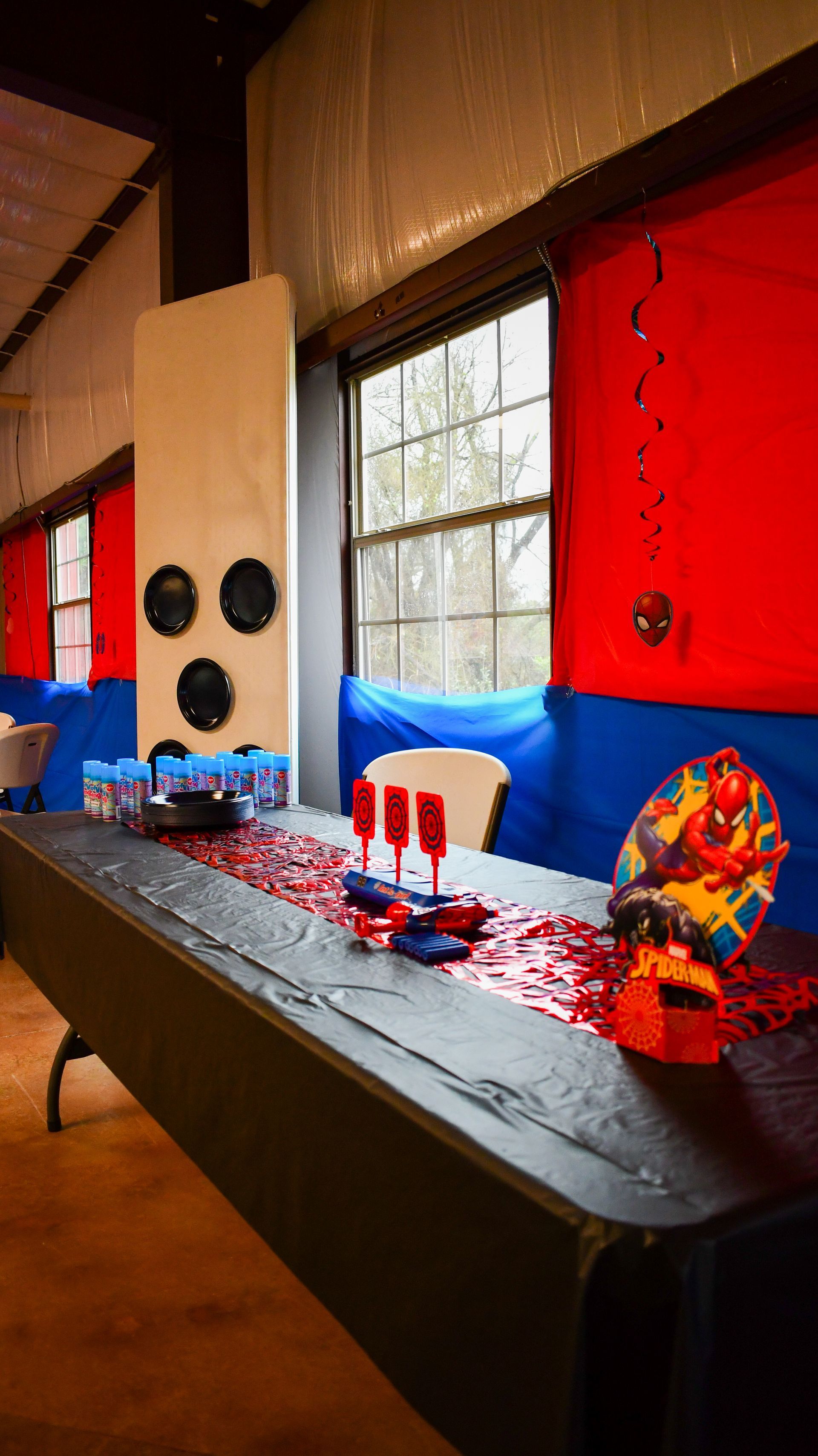 Party table decorated in red and blue with a Spider-Man theme.