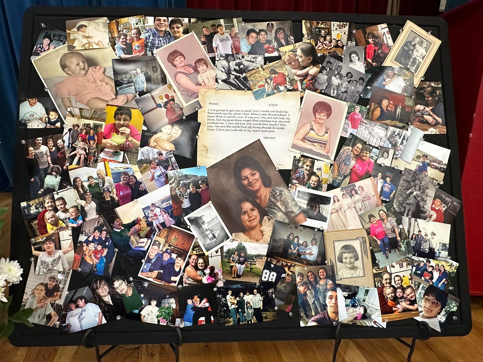 Photo collage on display board with various family photos.