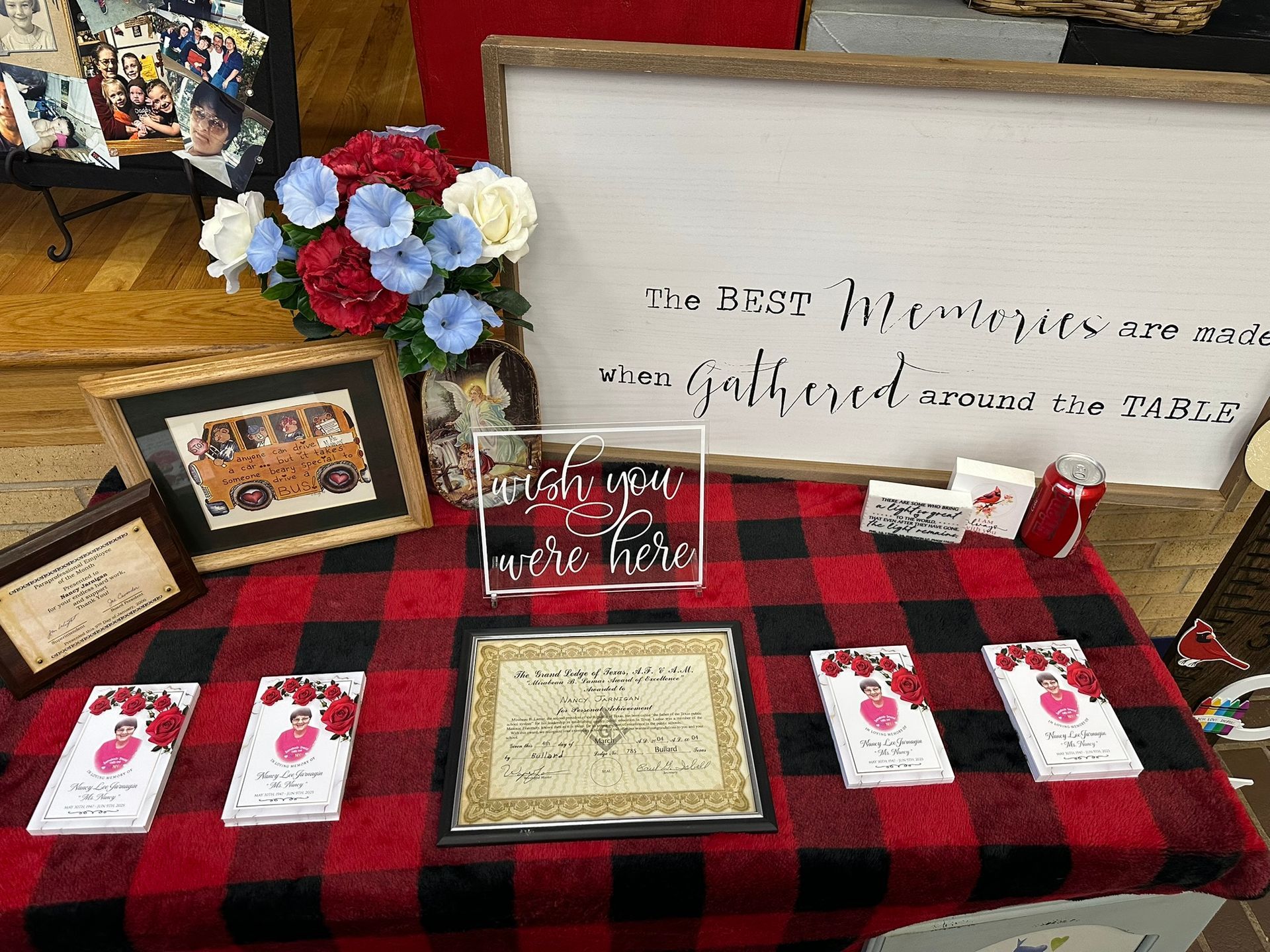 A display table with rustic decor and books, featuring a sign that reads 