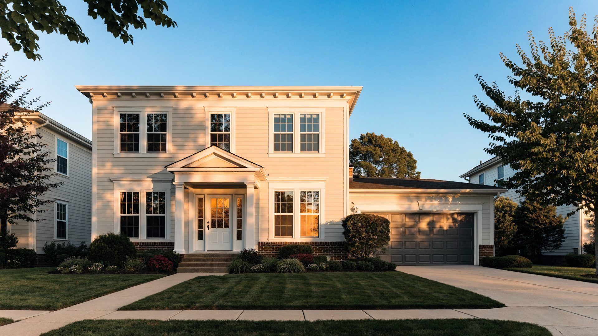 Well maintained suburban New Jersey colonial home with fresh paint and a new garage door, ready for