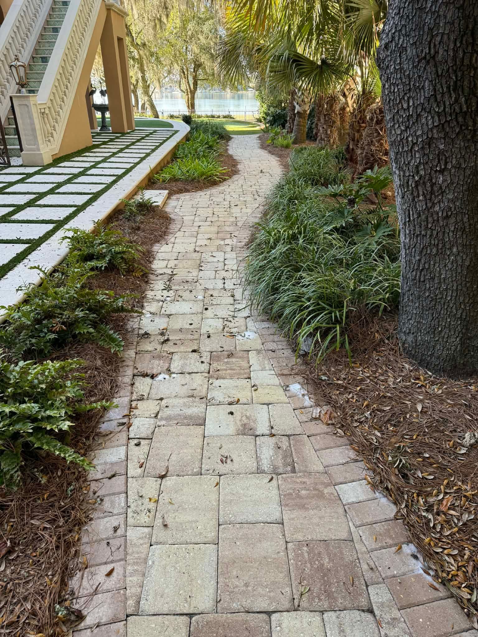 Residential paver walkway before cleaning and matte-finish sealing in Fort Walton Beach, FL