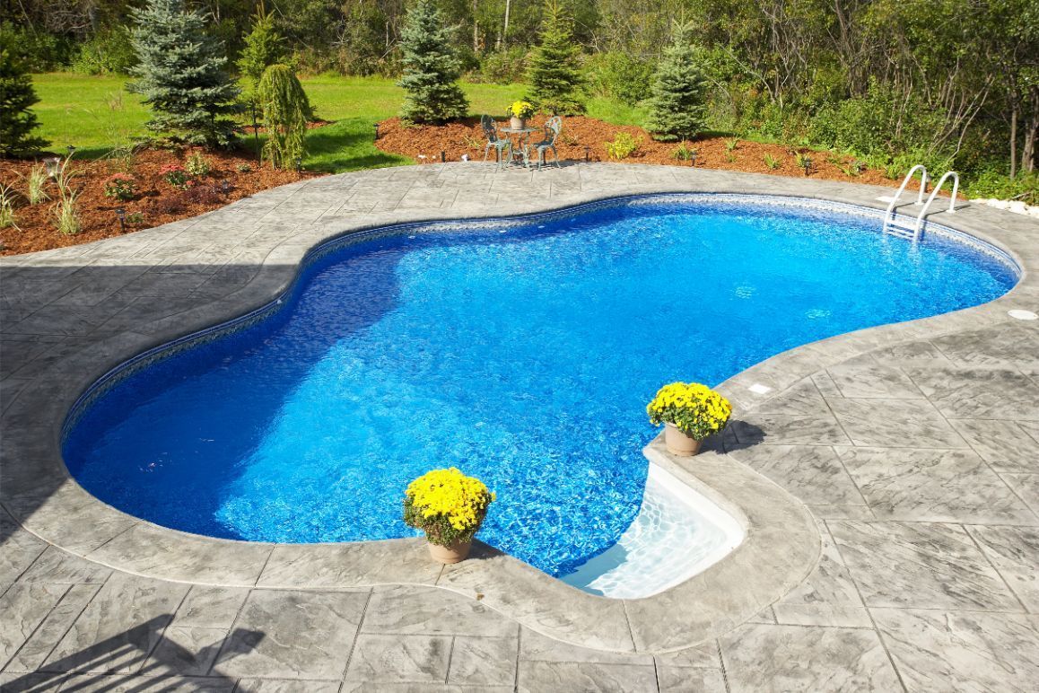 small leaf rake collecting leaves in a pool.
