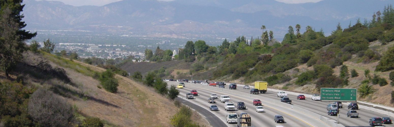 A highway with a lot of traffic going down it