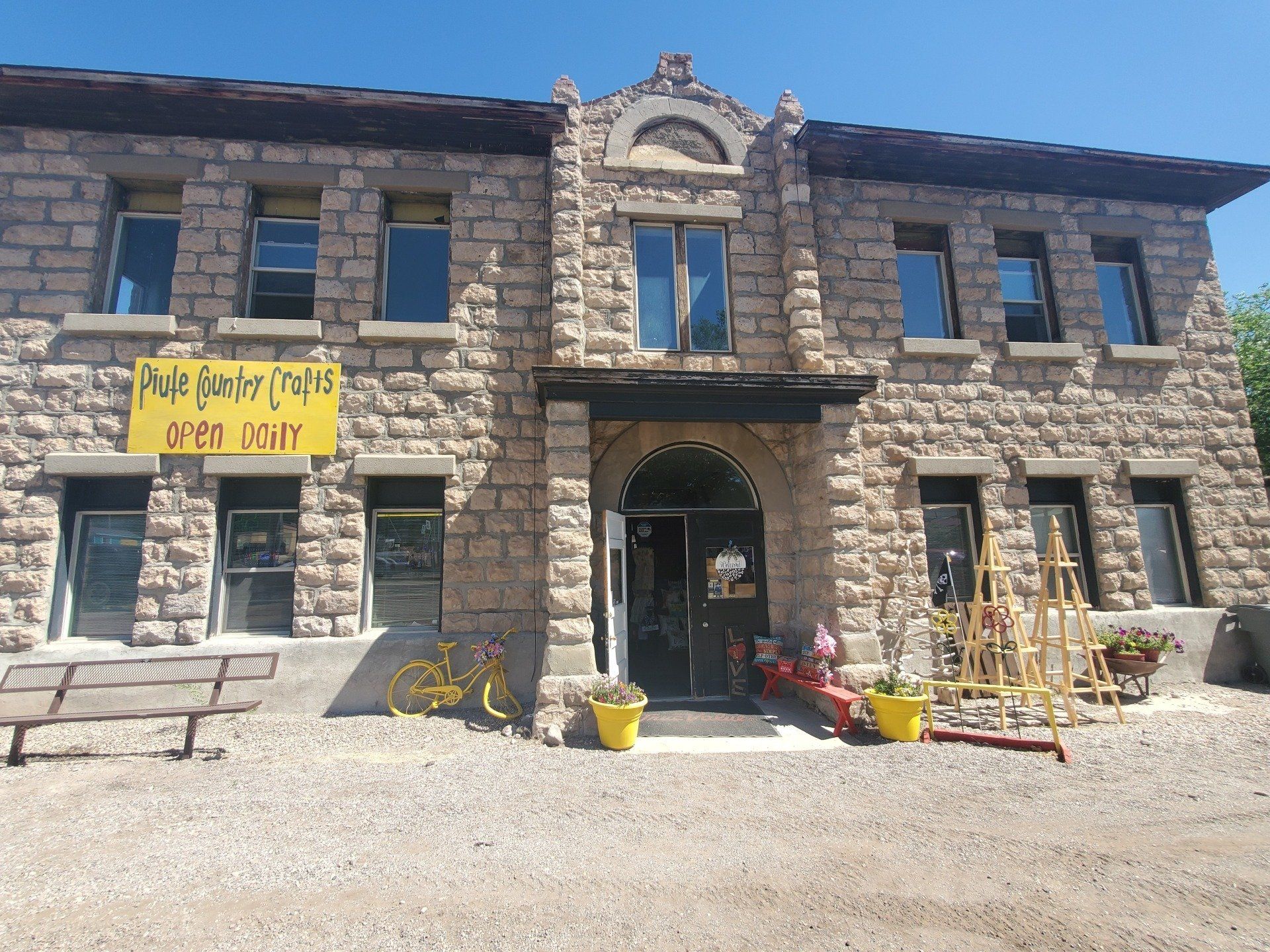 A large brick building with a yellow sign that says