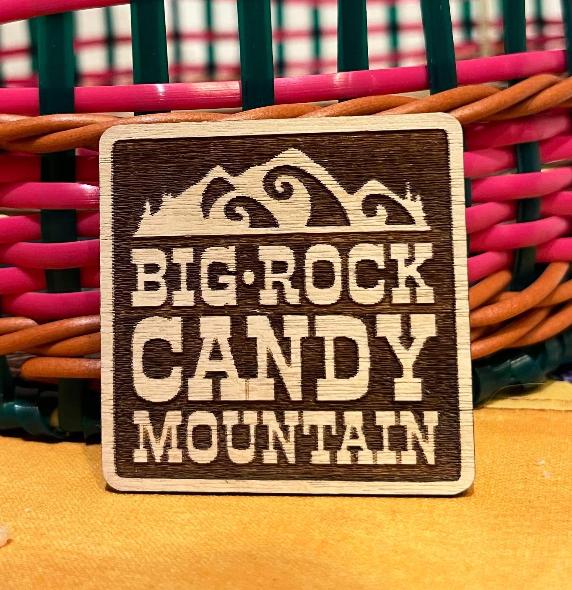 A wooden sign that says big rock candy mountain