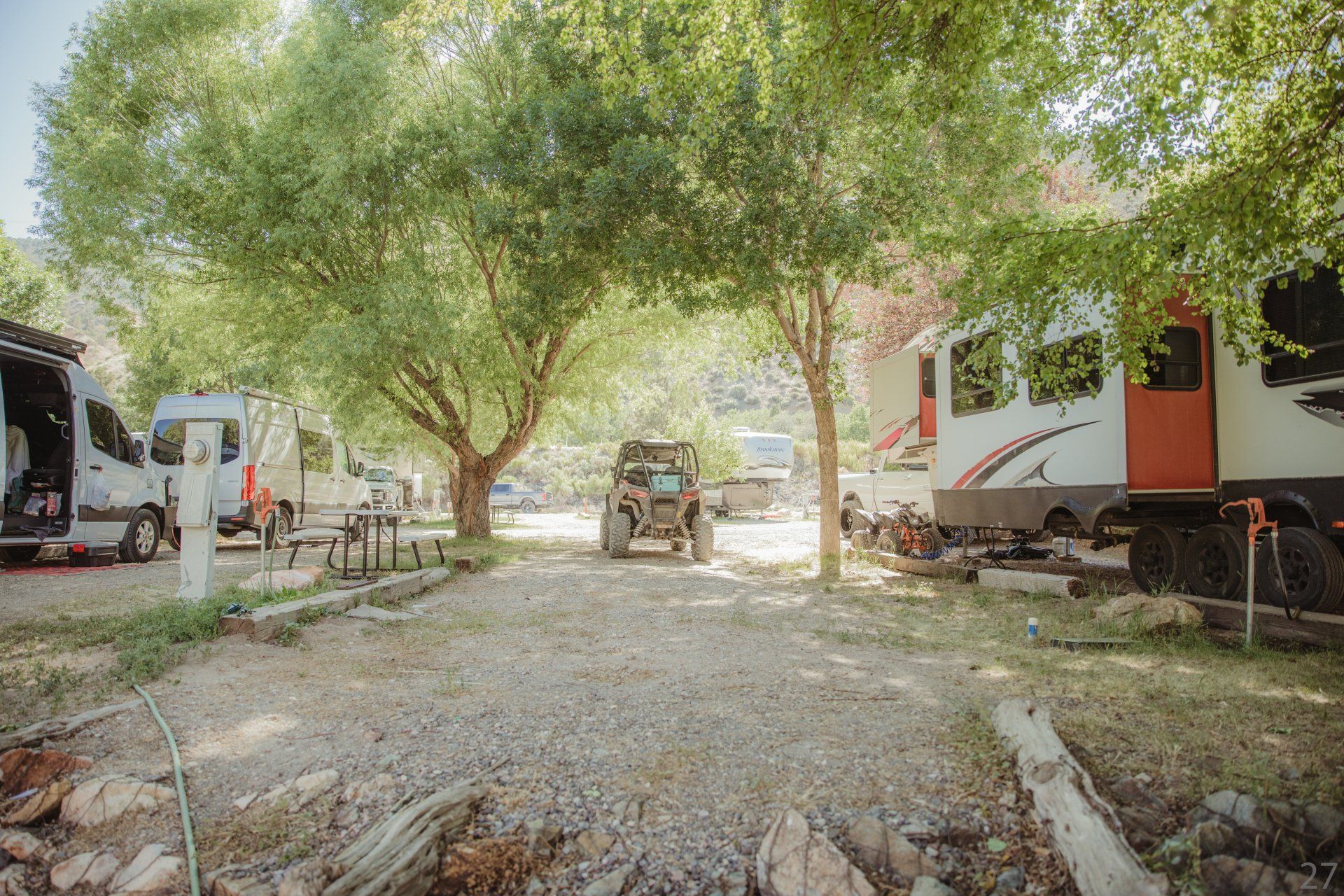 A group of rvs parked next to each other in a campground.