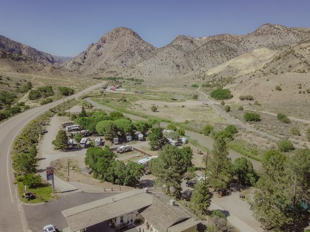 An aerial view of a campground with mountains in the background.