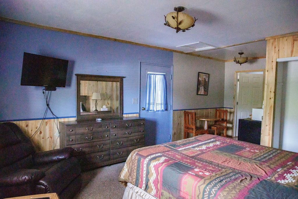 There is a large bed in the middle of the room.