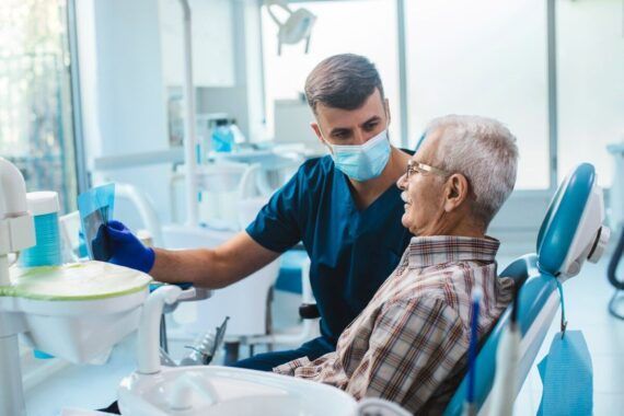 Dentist Examining a Patient in a Bright Clinic — Mareeba Dental Centre in Mareeba, QLD