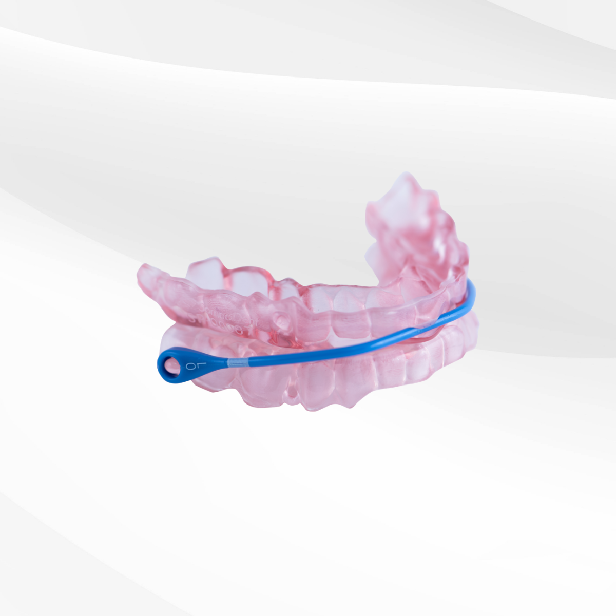 Pink Translucent Dental Aligner With a Blue Cleaning Brush — Mareeba Dental Centre in Mareeba, QLD