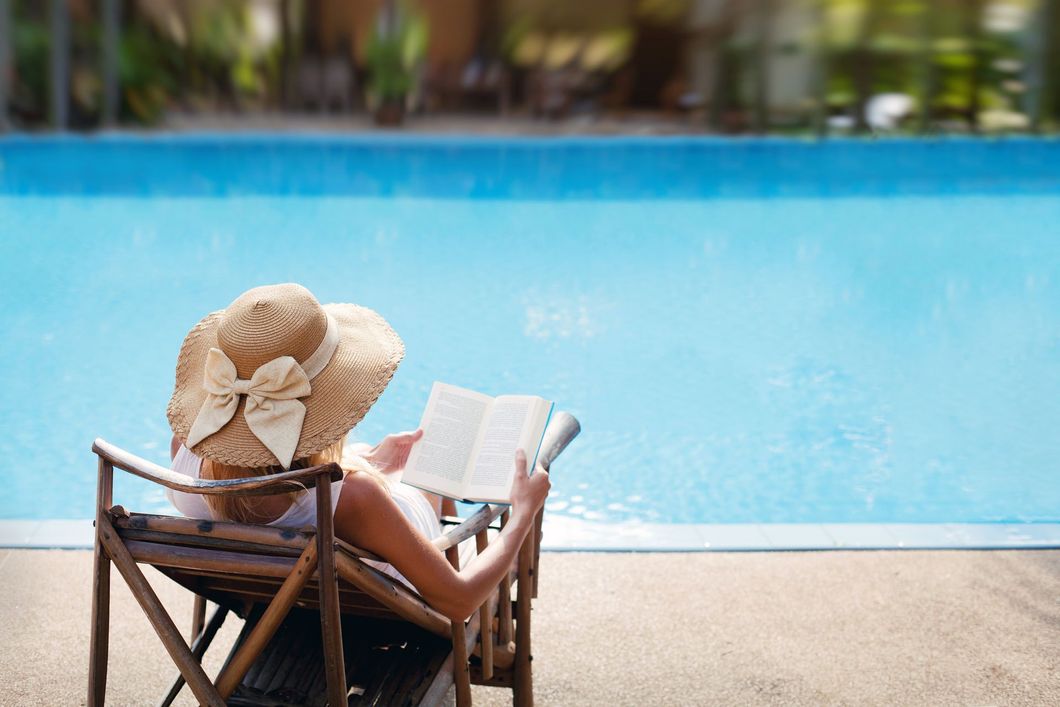 Resort-style pool and outdoor living at The Cottage Green Tomball apartment community in Tomball TX