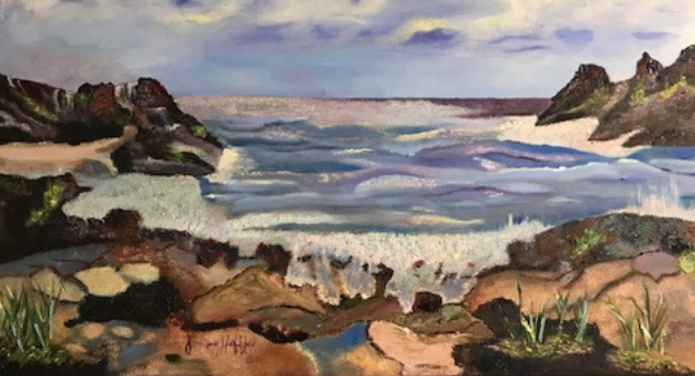 Rocky shoreline with waves under a cloudy pastel sky, framed by cliffs and boulders.