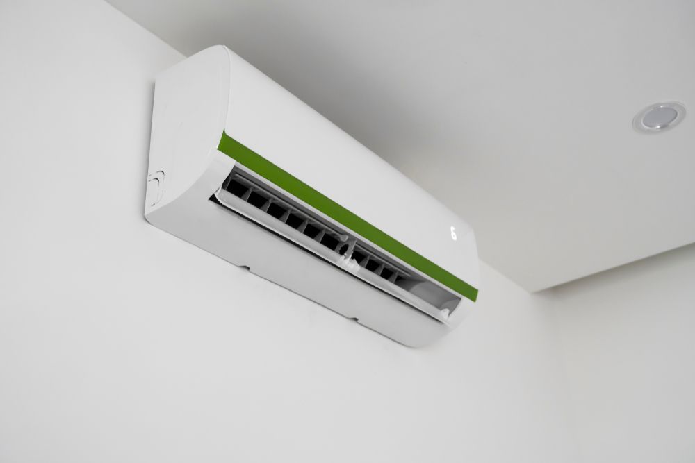 Wall-Mounted White Air Conditioner With Green Strip
