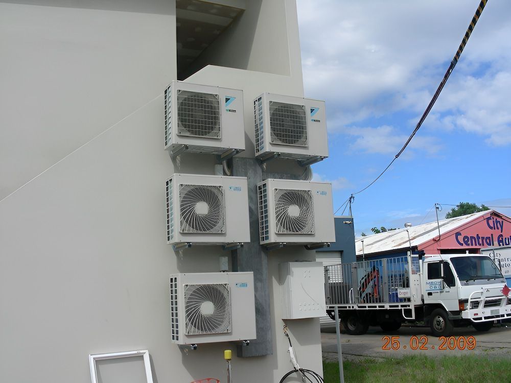Four Air-conditioned Mounted On Building — BT Airconditioning In Portsmith, QLD