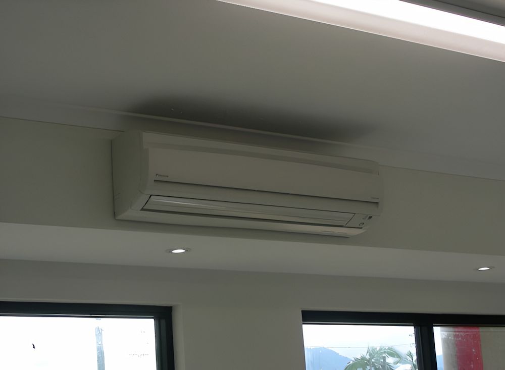 A White Air Conditioner Is Mounted To The Ceiling — BT Airconditioning In Portsmith, QLD