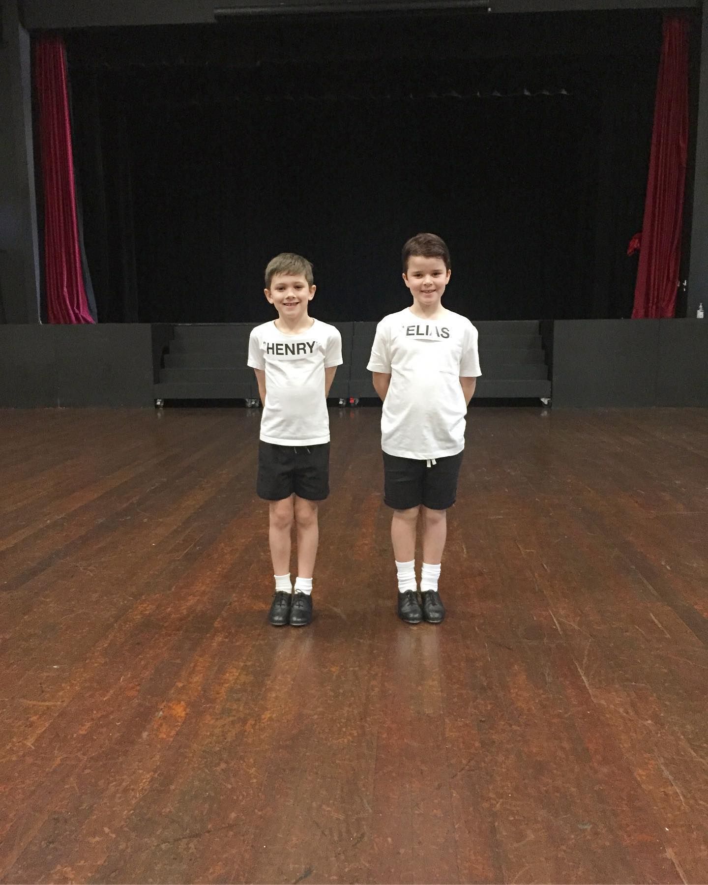 Two Young Boys in Dance Attire Standing on a Wooden Stage — Kay Flynn Dancing Academy Southport in Southport, QLD