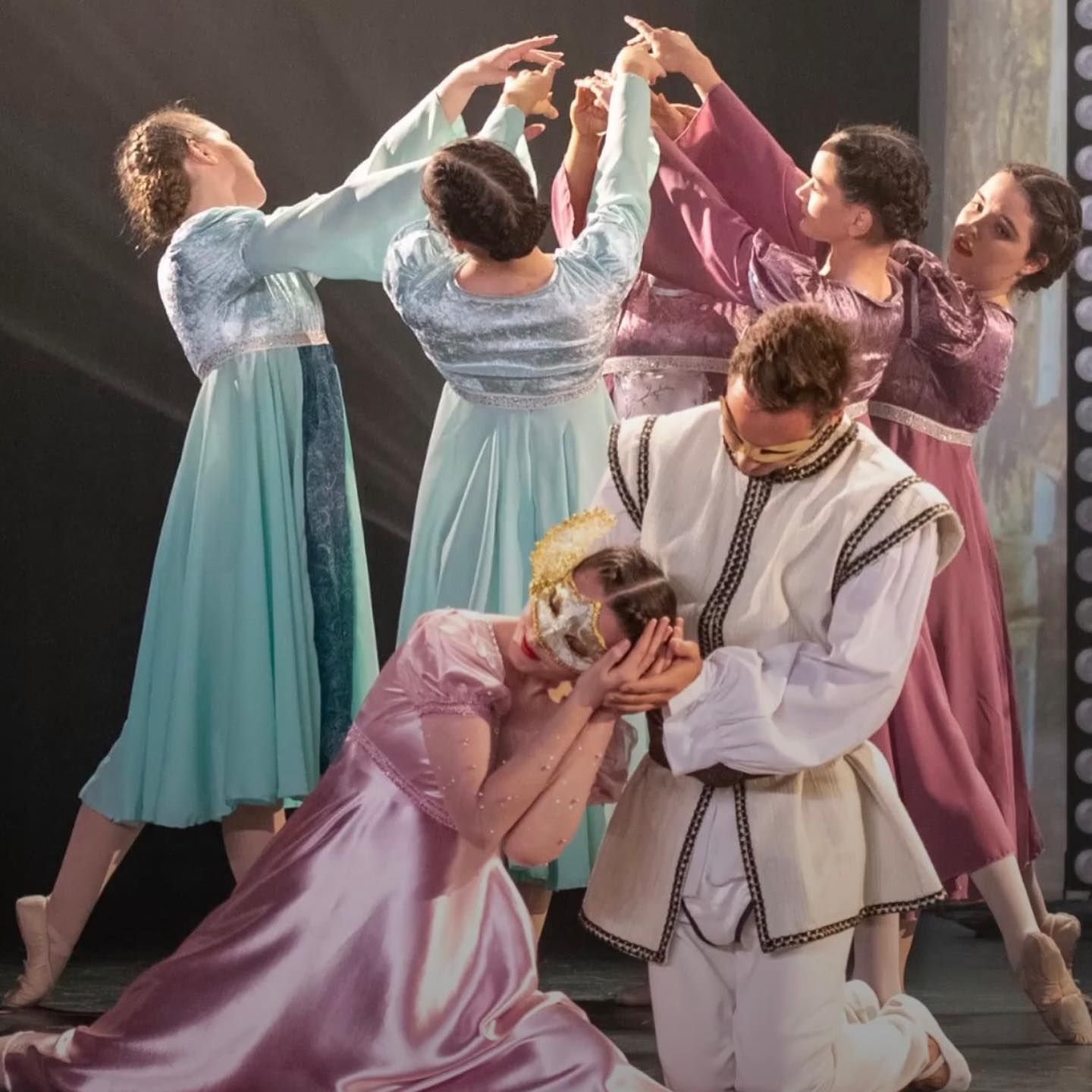 Dancers in Pastel Gowns Surround a Kneeling Man in White — Kay Flynn Dancing Academy Southport in Southport, QLD