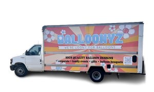 White delivery truck with BALLOONYZ branding, floral graphics, and text advertising balloon designs.
