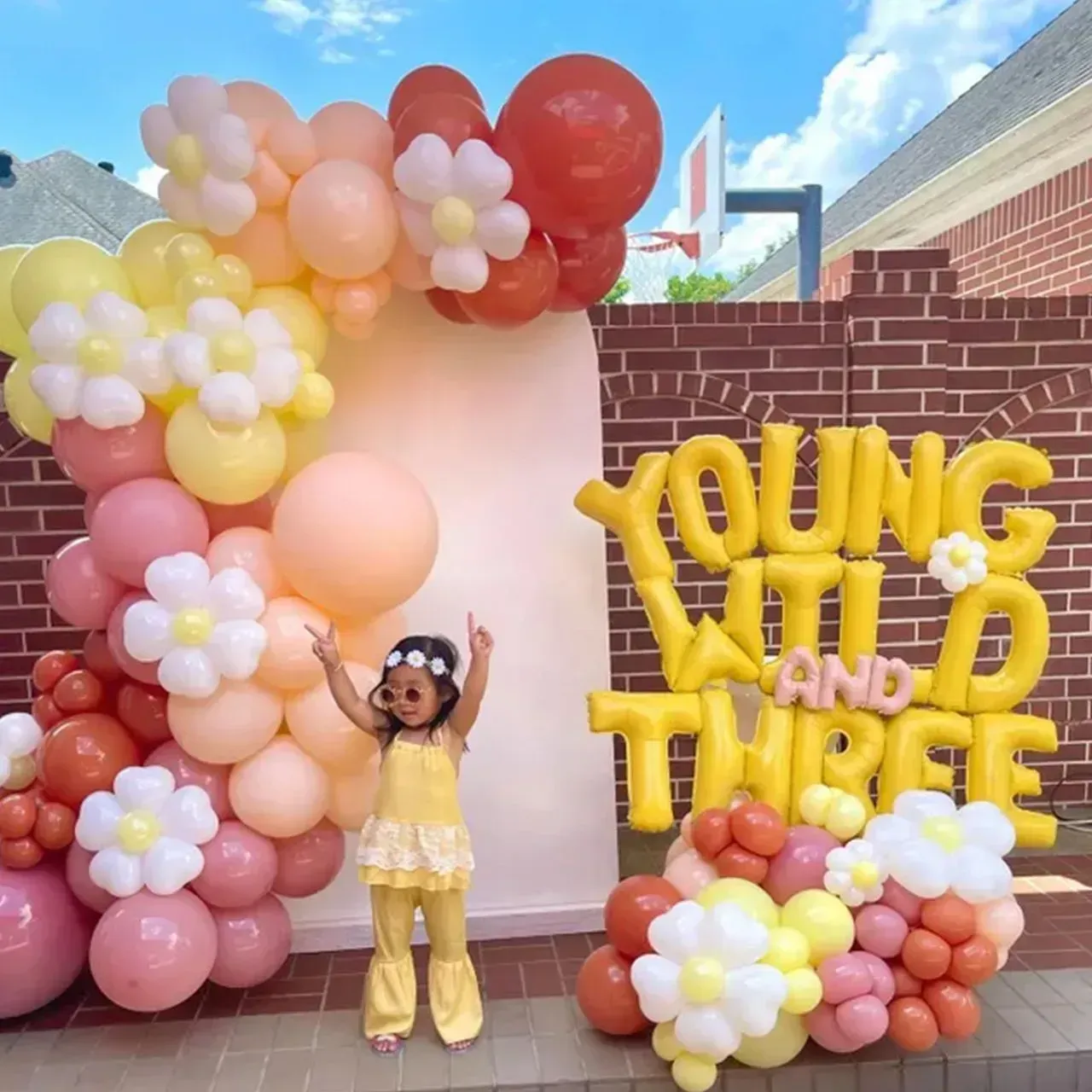 Girl in yellow outfit celebrates birthday with 