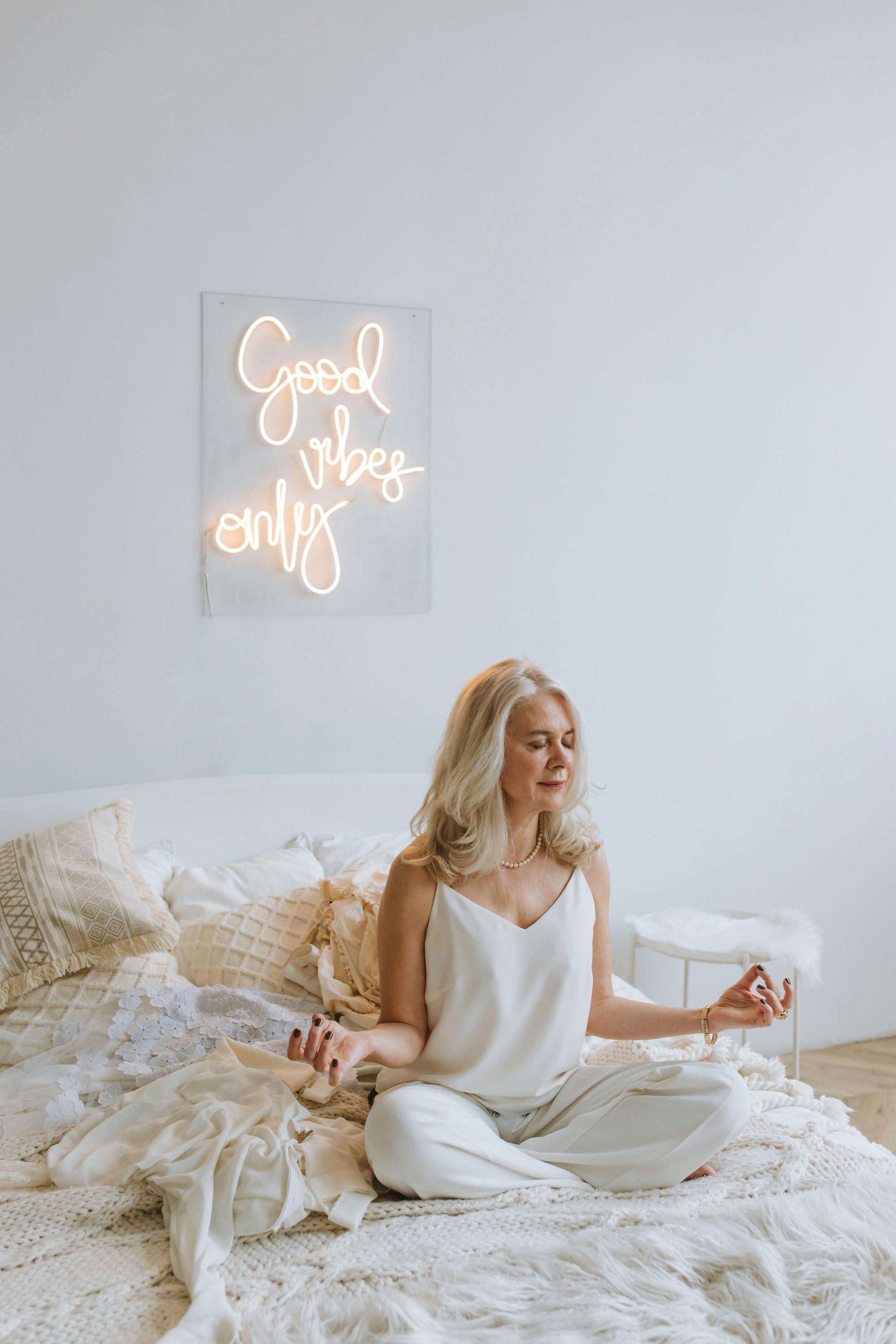 woman sitting on a bed