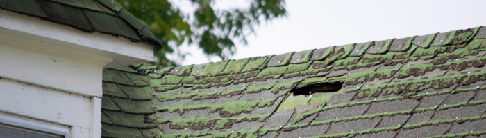 old roof with large hole
