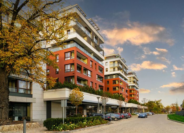 A building with a lot of windows and balconies. A building with a lot of windows and balconies.