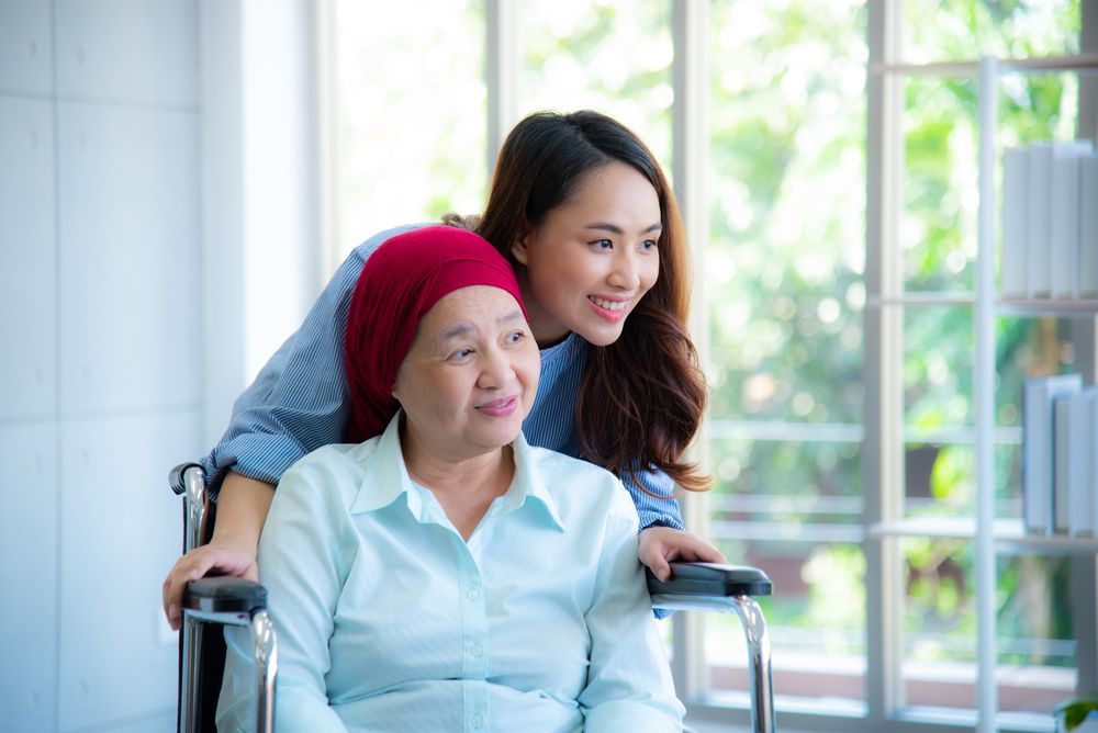 a woman in a wheelchair is being helped by another woman