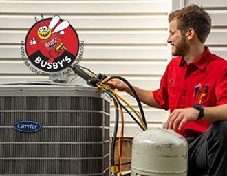 HVAC technician repairing an AC system at a home in Harlem, GA