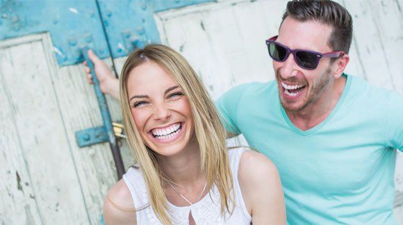 Couple with Beautiful Teeth — Palm Bay, FL — Babcock Dental Center LLC Couple with Beautiful Teeth — Palm Bay, FL — Babcock Dental Center LLC
