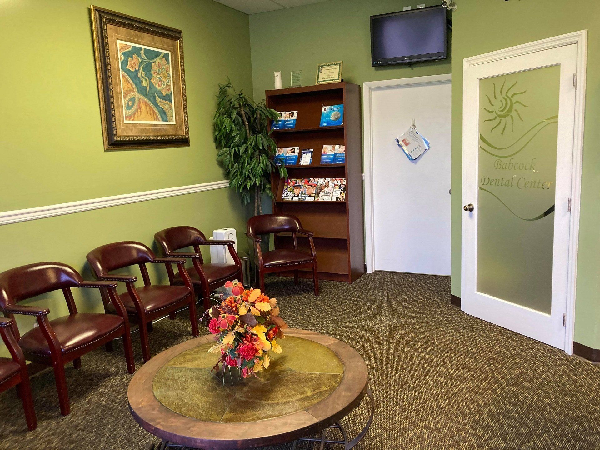 Dentist Examining Patient Mouth — Palm Bay, FL — Babcock Dental Center LLC