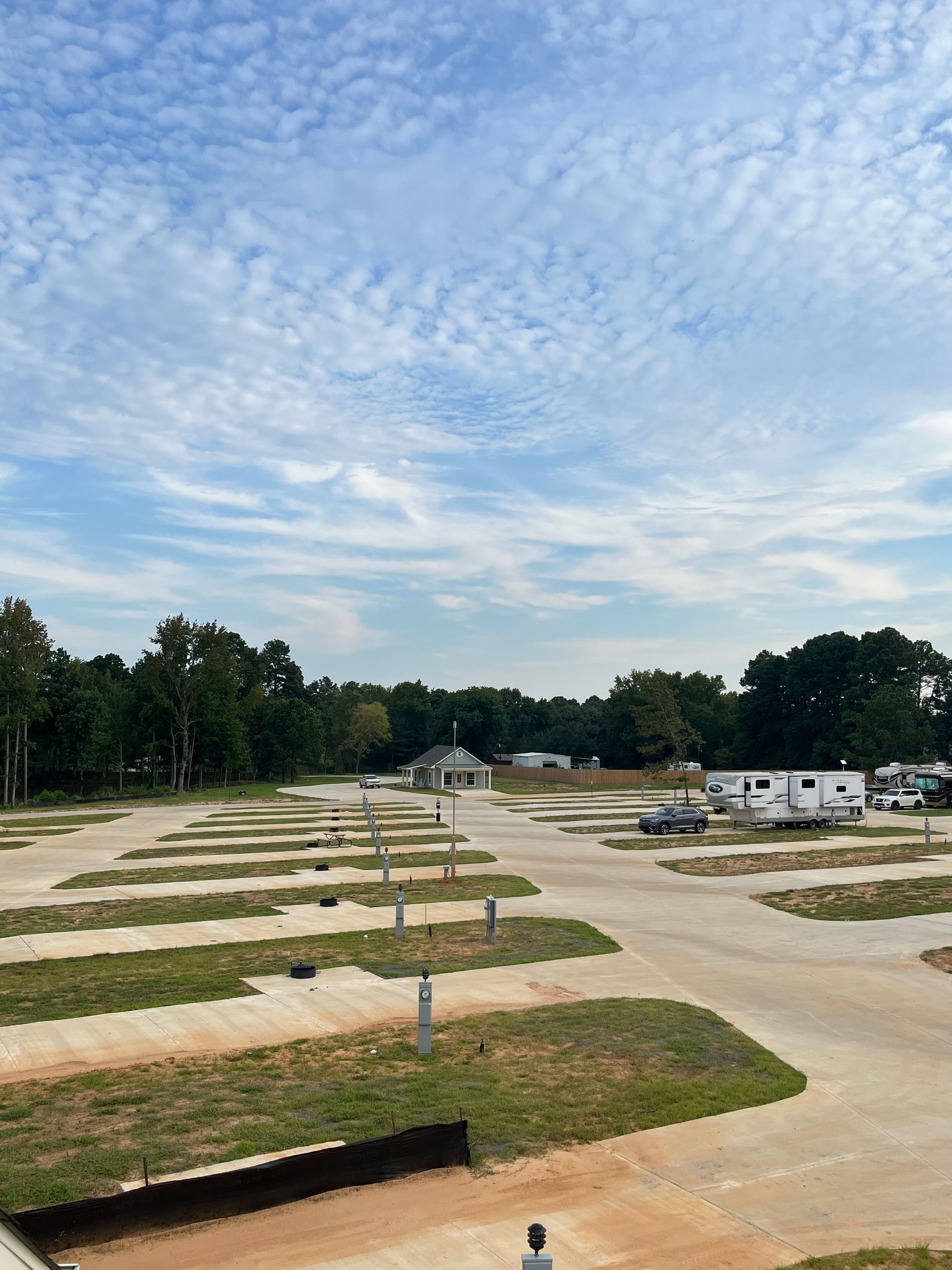 An aerial view of a rv park on a sunny day