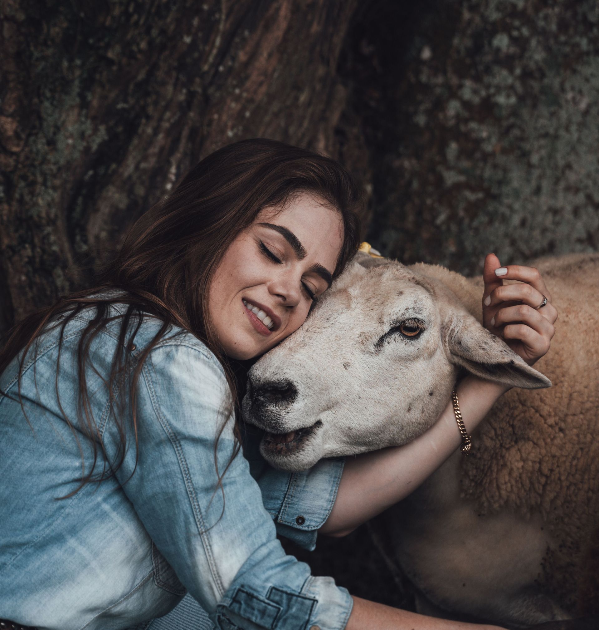 Young Woman Showing Compassion Toward a Sheep