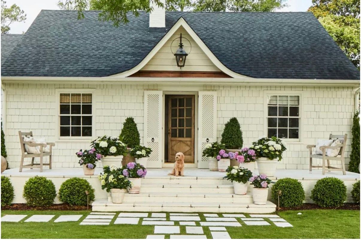 A cute well kept house with nice landscaping
