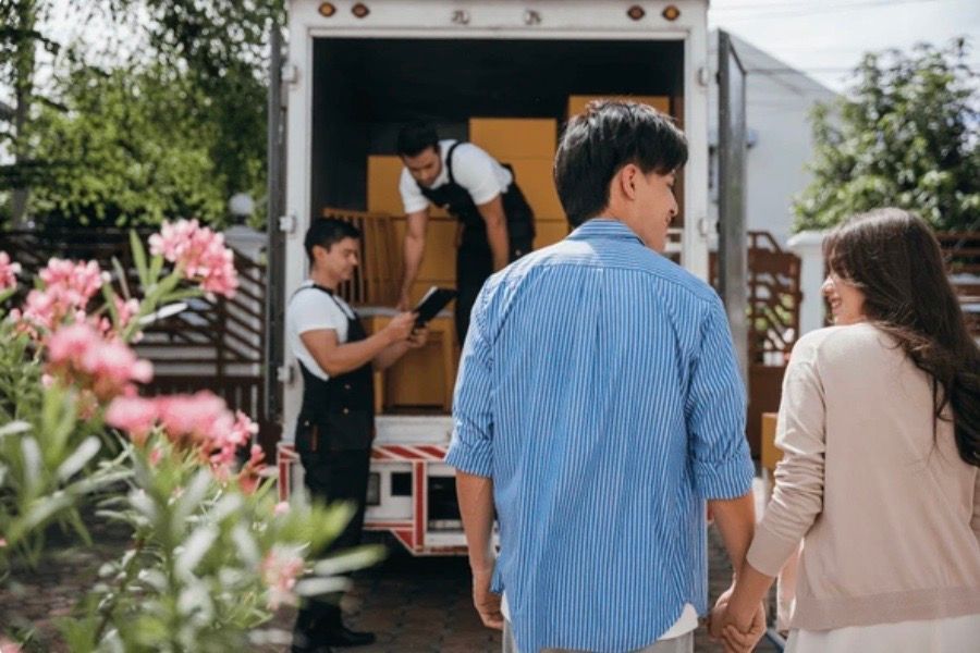 A couple looking at a moving truck