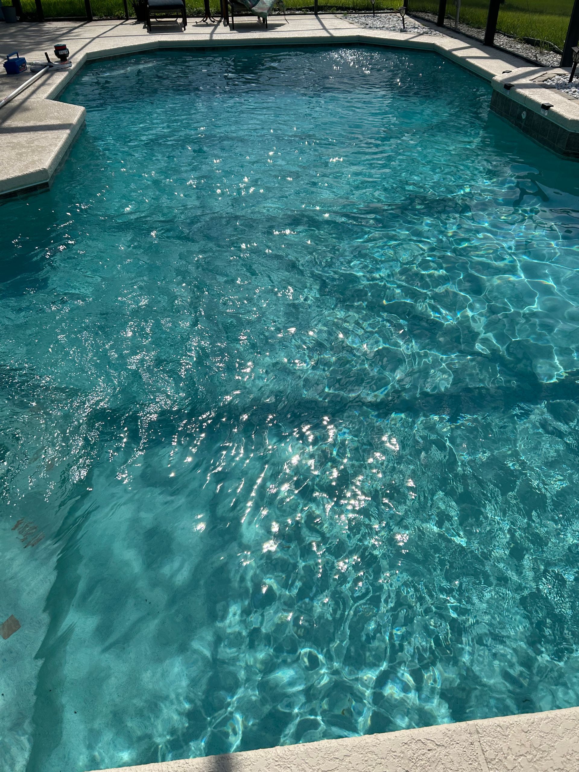 A large swimming pool filled with clear blue water.