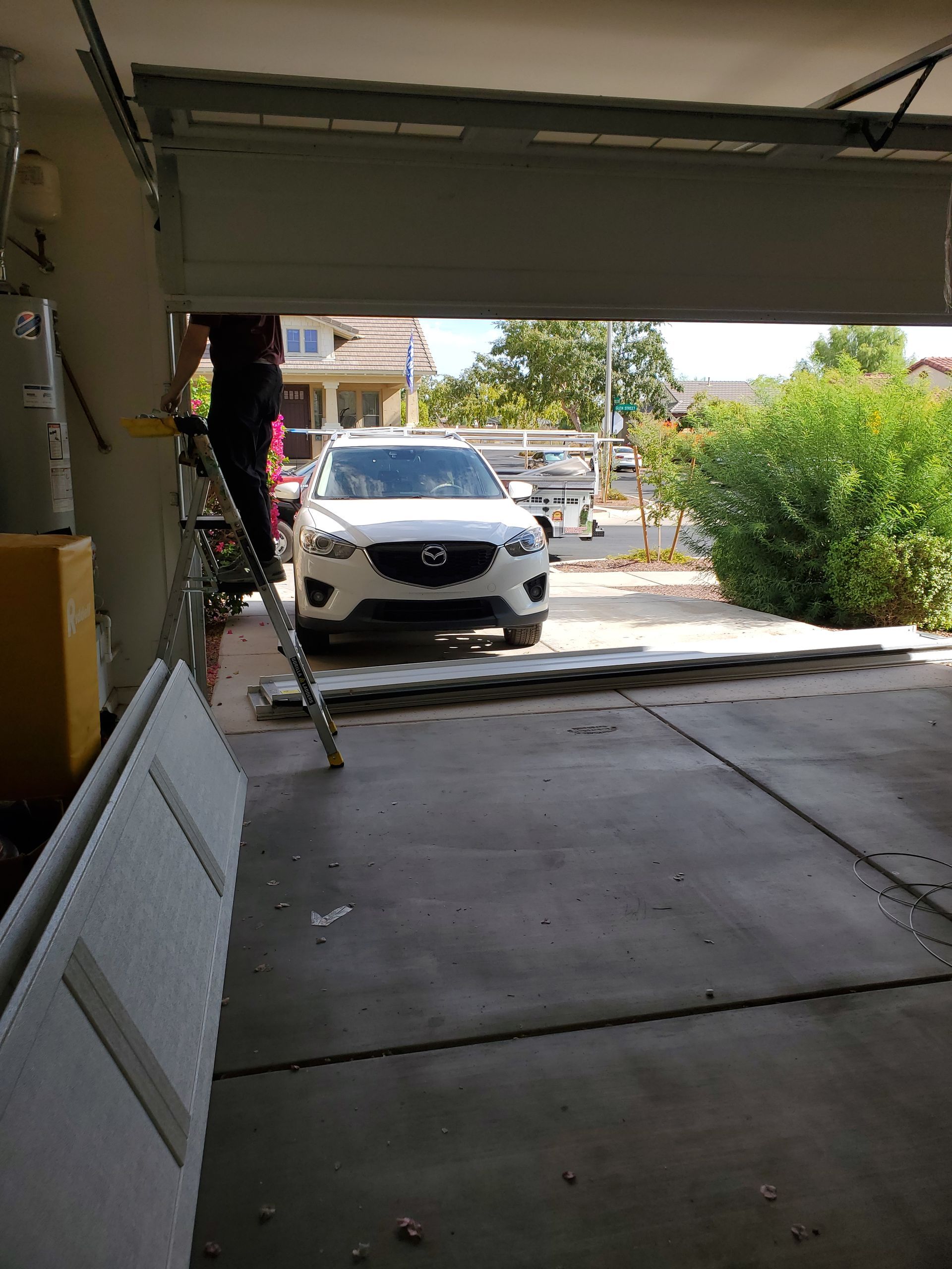 garage door tech working on new installation