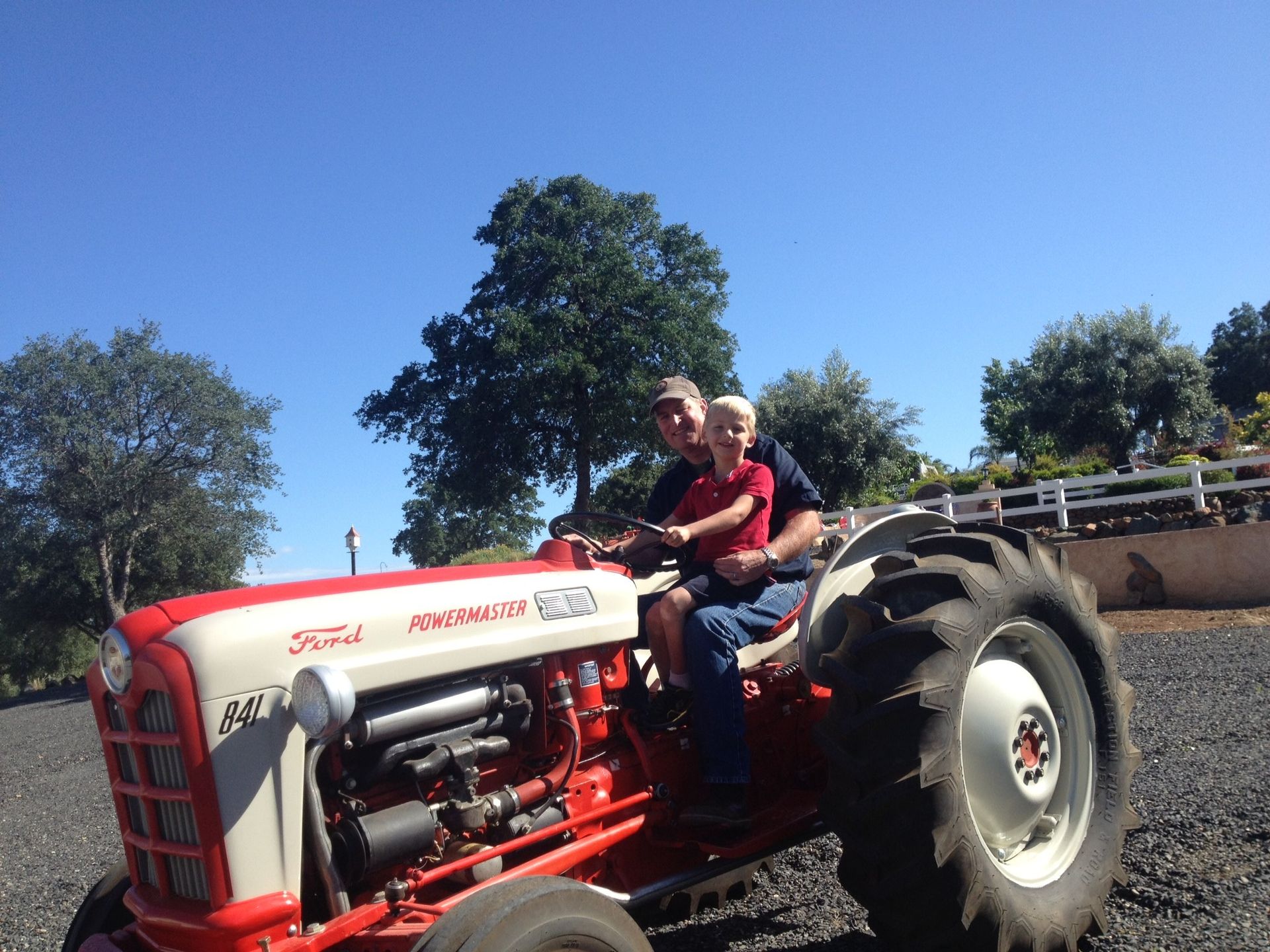 Jamie and his son on the tractor.