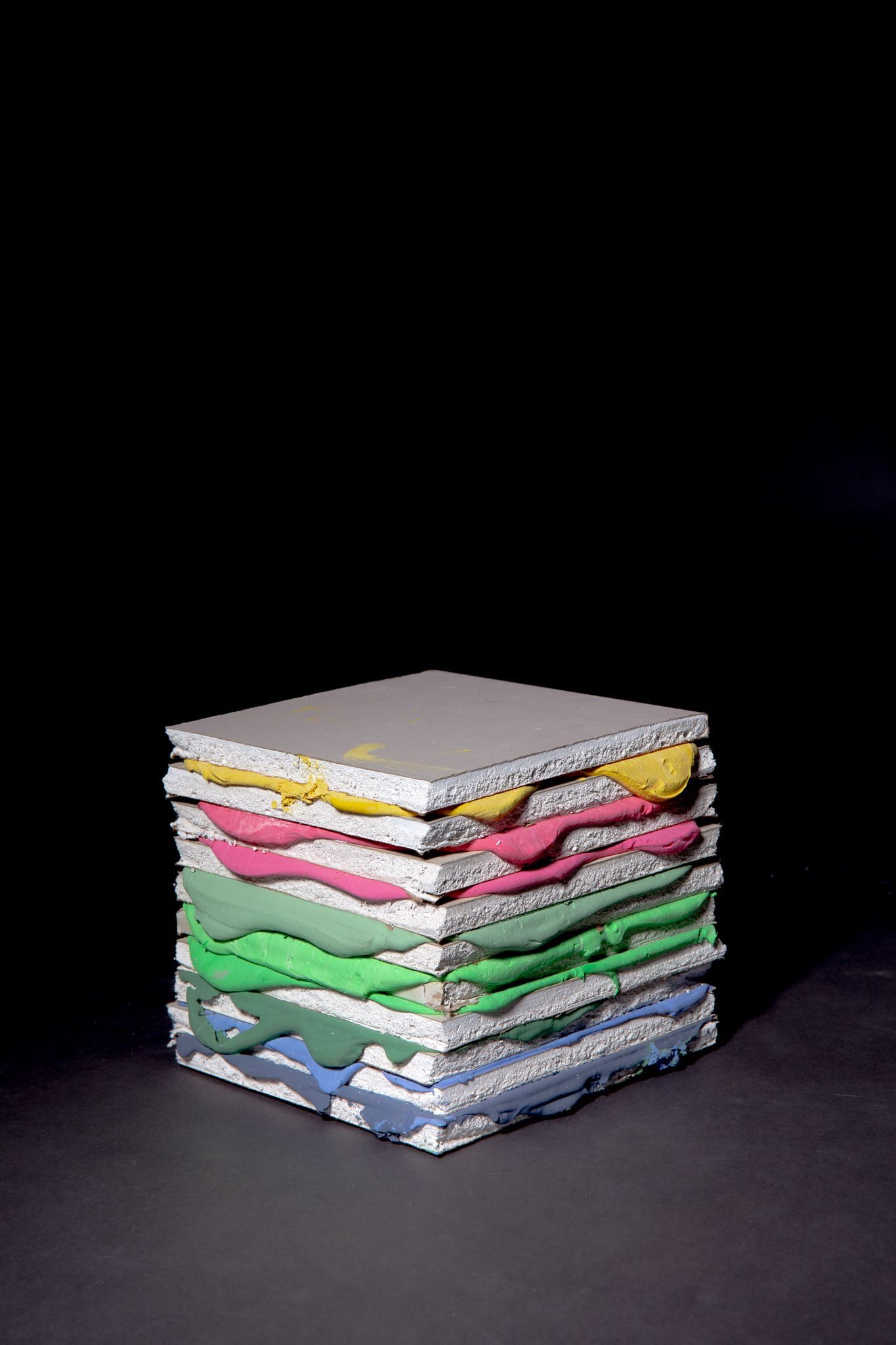 A colorful square made of layered, textured material; art by Matt Remsbecher. 