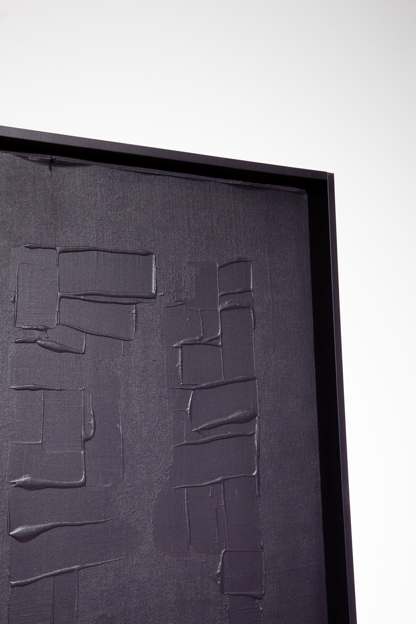 Textured, dark purple artwork in black frame, with abstract, rectangular shapes; art by Matt Remsbecher. 