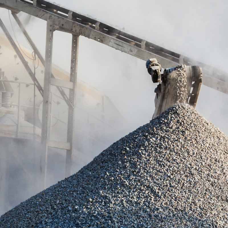 Crusher dust forming a pile under a conveyer belt