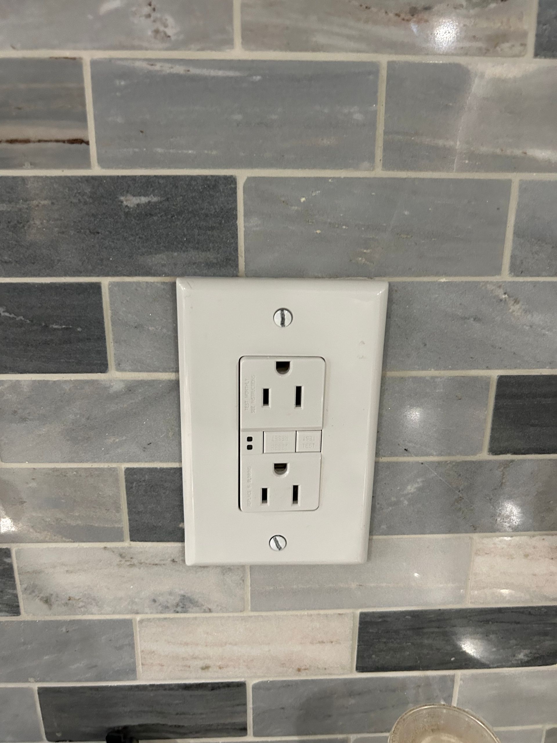 electrician holding a light bulb