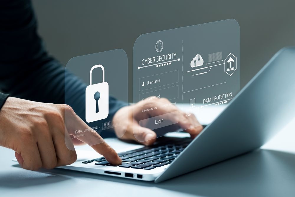 Hands Typing on a Laptop With a Digital Lock Icon — Compago Technologies In Cambridge, TAS
