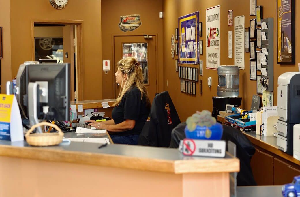 Autoshop Clerk Working on Desk | Camarillo Independent Automotive Repair