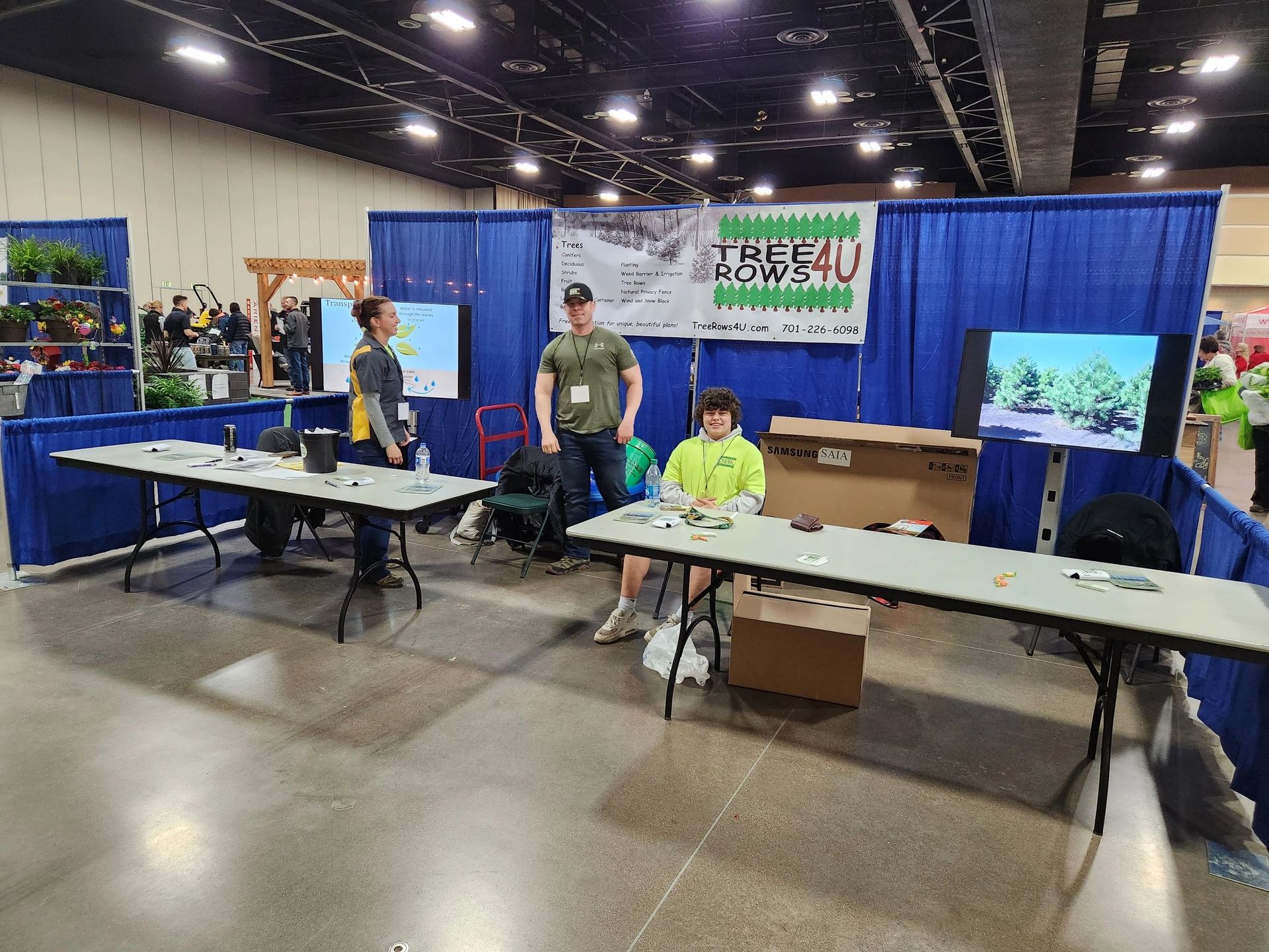 A group of people are sitting at tables in a room.