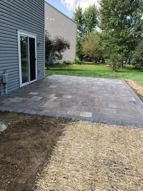 Completed backyard brick paver patio installation.
