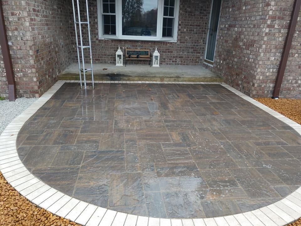 Arched brick paver patio entry at a brick residential home in Greensburg IN