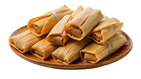 A wooden plate topped with tamales on a white background.