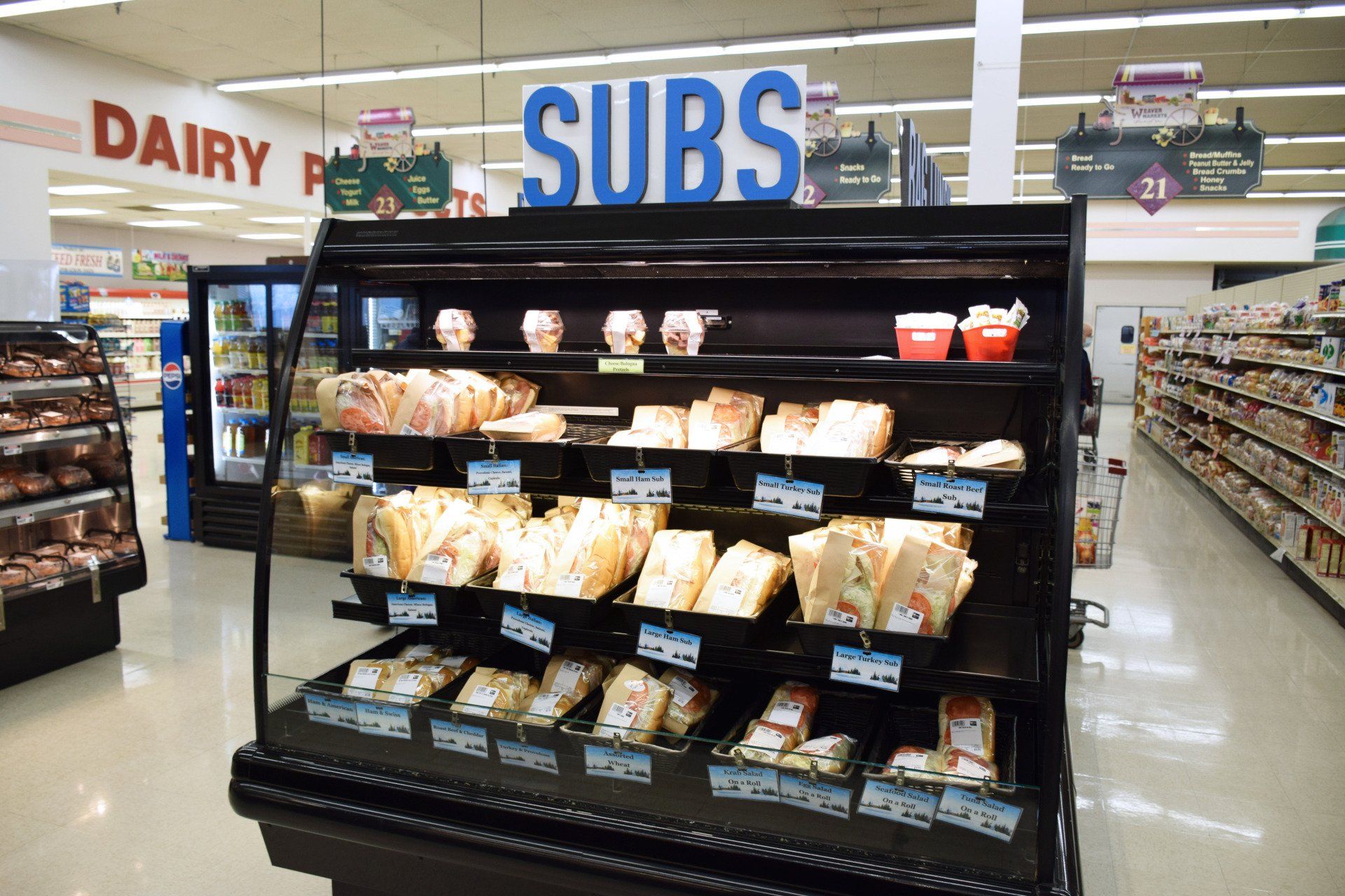 A display of subs in a grocery store